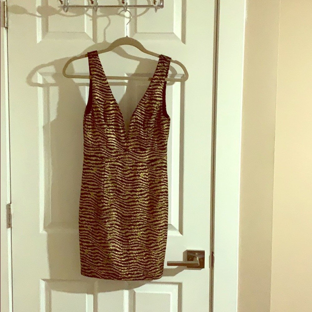 Gold and black mini dress.